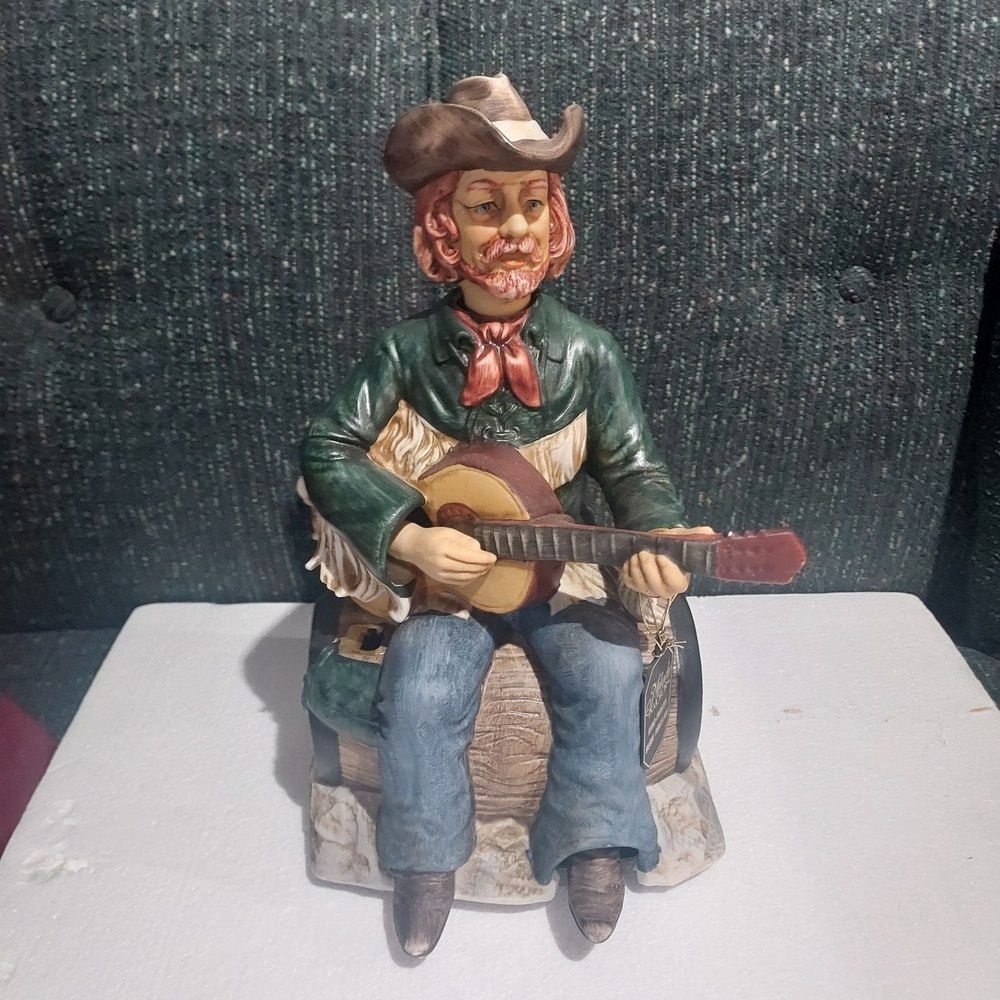 Rustic Cowboy Sculpture with Guitar